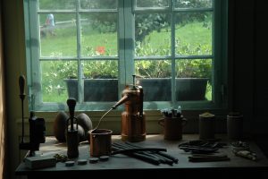 brown kettle on stove near window